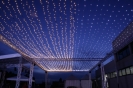 fairy lights like ceiling of stars above the dinner tables